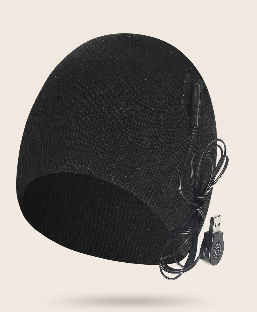 Black heated knit beanie with USB lead on a plain background