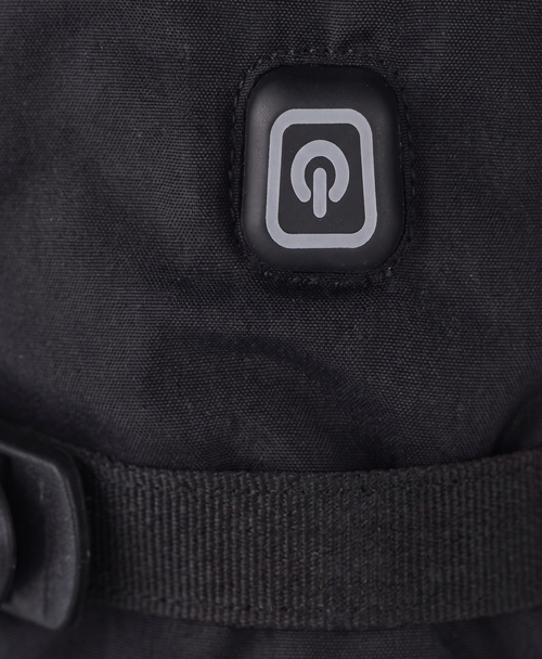 Close-up of the battery case with its cord and ON/OFF switch used to power the heated gloves