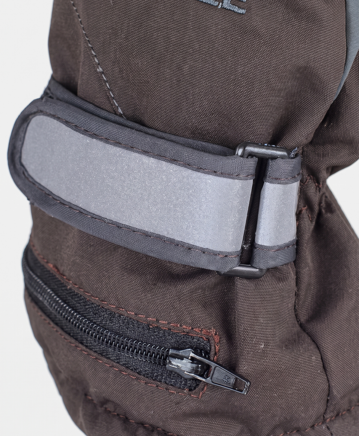 Close-up of the grey heated glove cuff with zippered pocket, adjustable wrist strap and ribbed knit lining