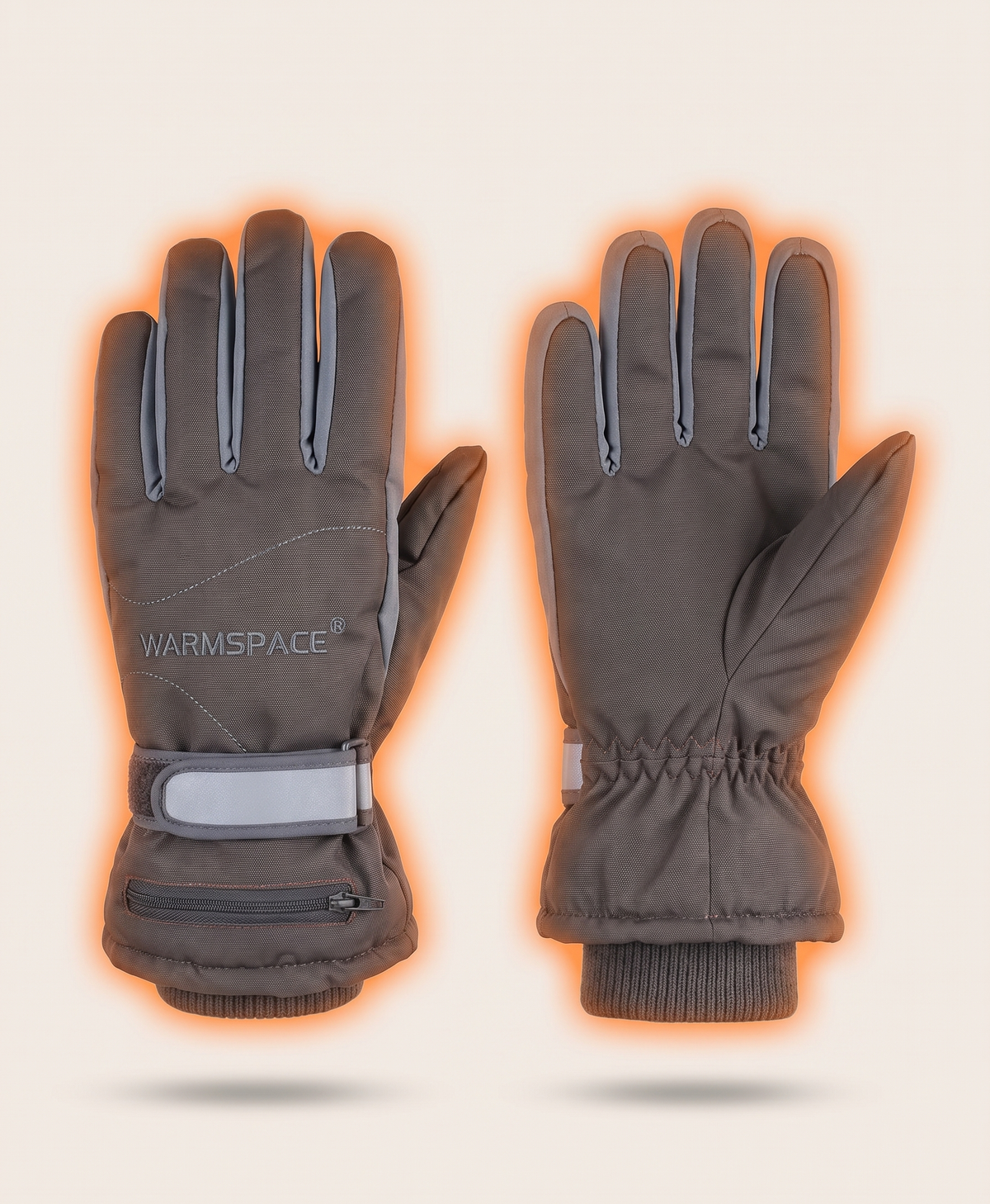 Grey heated gloves with the power cable running from the cuff area, showing how the rechargeable power connects