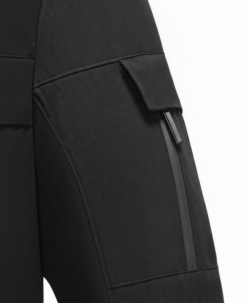 Close-up of the black jacket's high collar, lined interior, chest pocket zips and sleeve pocket