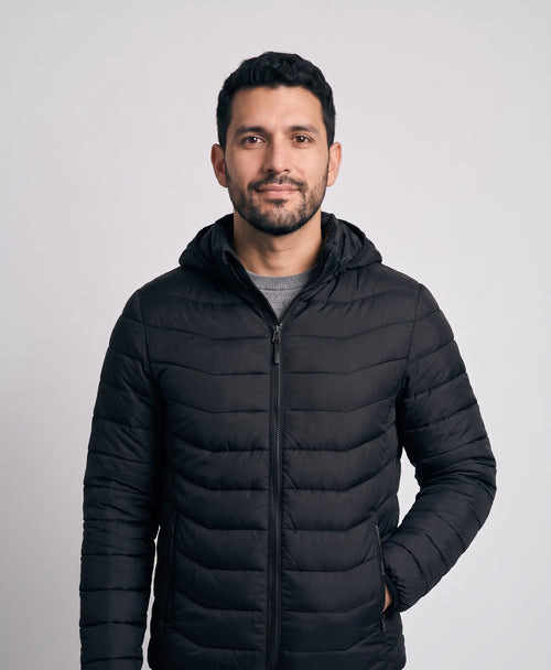 Man wearing the Coziva men's heated puffer jacket in black