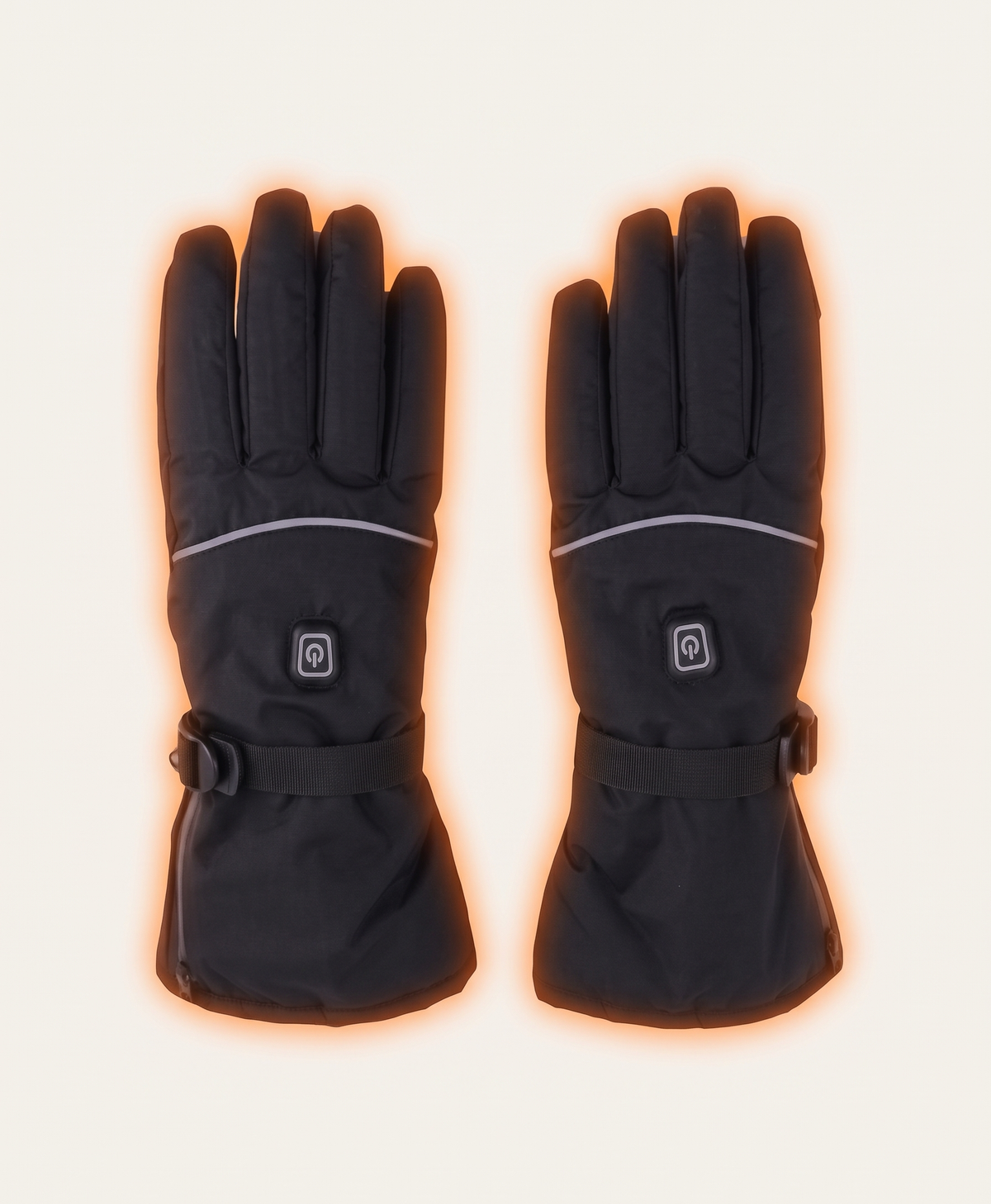 Two black heated gloves against snowy mountains showing the power button, reflective stripe and cuff strap