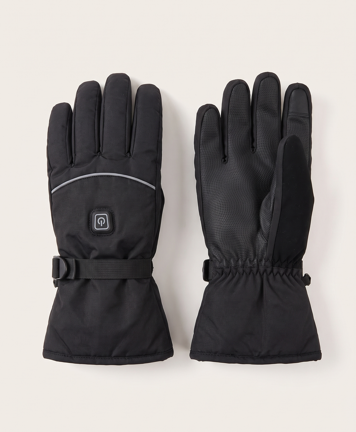 Two black split-finger heated gloves shown from above against a blue sky and snowy mountain