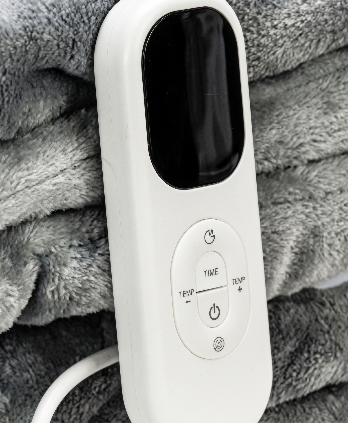 Close-up of the white controller with LED display and power, time and temperature buttons