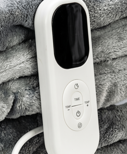 Close-up of the white controller with LED display and power, time and temperature buttons