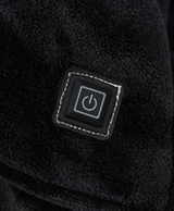 Close-up of the large front pocket and heating control button on the oversized hoodie