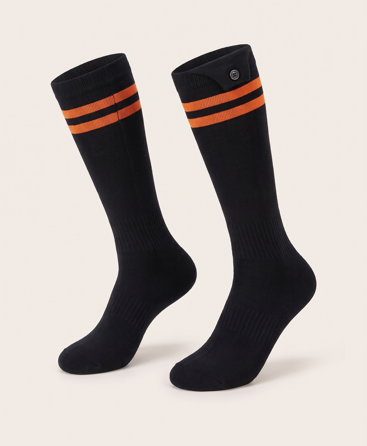 Pair of black high heated cotton socks with a striped cuff and a button on the cuff, shown on their own