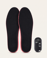 Pair of heated insoles with glowing heat grid, remote control and white USB charging cable