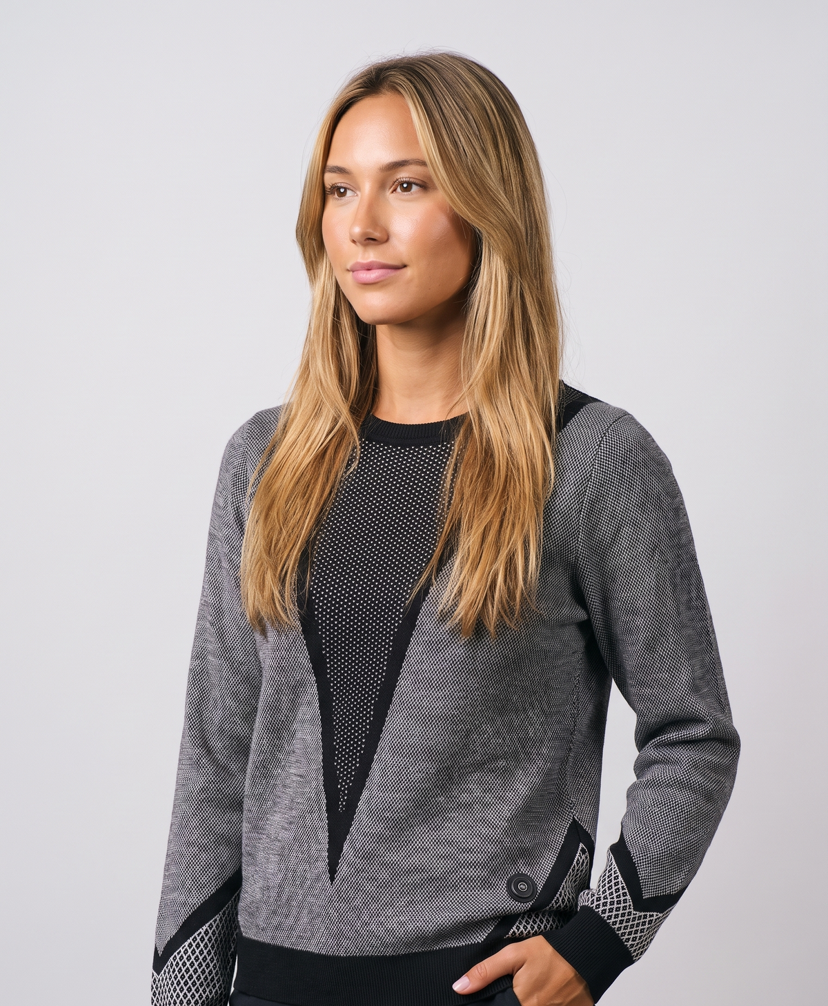 Woman wearing the women's heated knit sweater, round neck and long sleeves, studio-style photo