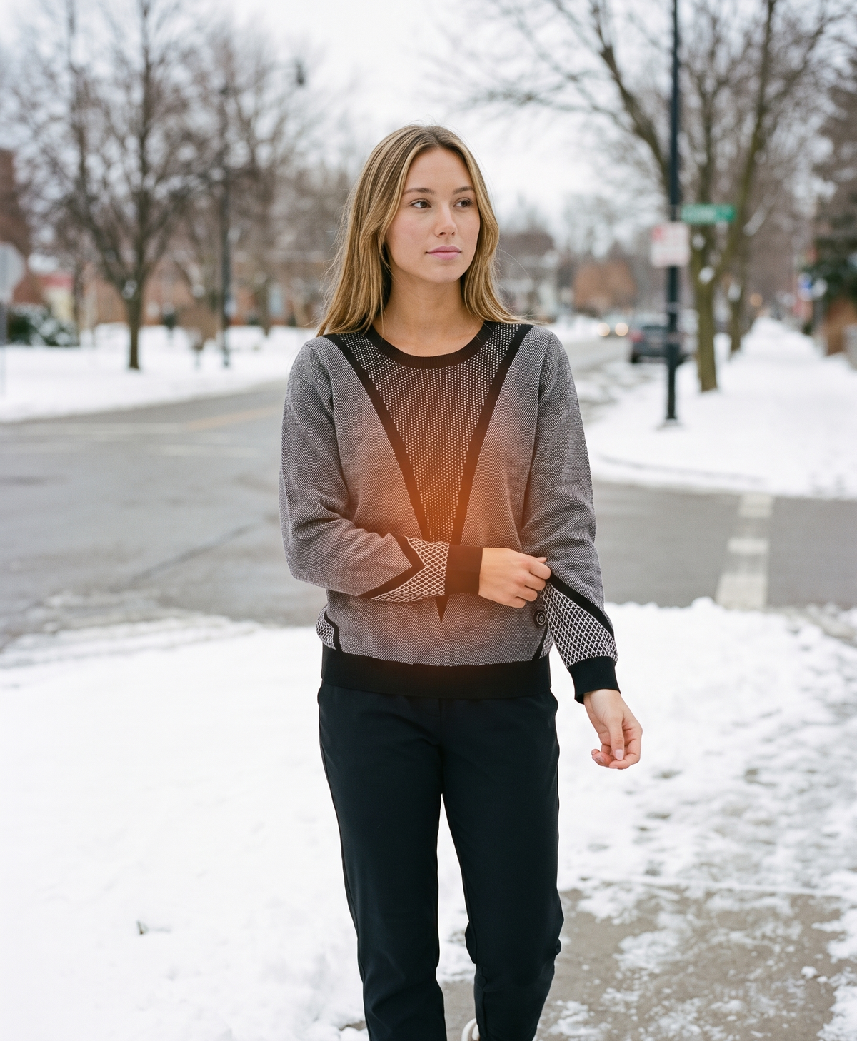 Lifestyle photo of a woman in the knitted sweater in a snowy winter setting