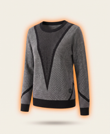 Woman wearing the heated knit sweater with a flame graphic and marker pointing at the front panel