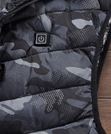 Close-up of the chest power button and quilted stitching on the men's camouflage heated vest
