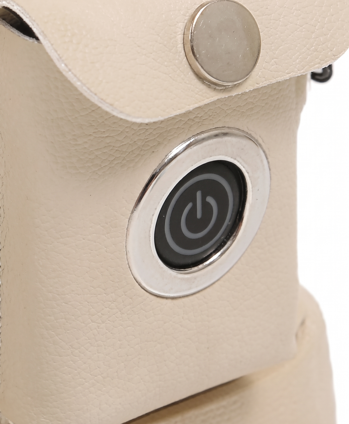 Close-up of the thick, soft plush lining at the opening of a heated snow boot, held in two hands