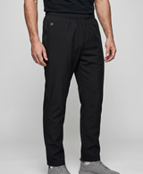 Man wearing black heated pants, front view, showing the elastic waist and straight legs