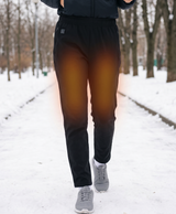 Black women's heated pants with plush lining worn for cold-weather outdoor activity