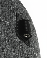 Close-up of the black connector patch and ribbed gray knit on the side of the heated beanie