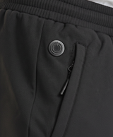 Close-up of black heated pants with elastic drawstring waistband and zippered side pocket