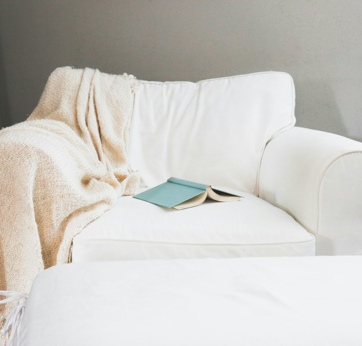 Coziva hero home - couch covered in a warm blanket